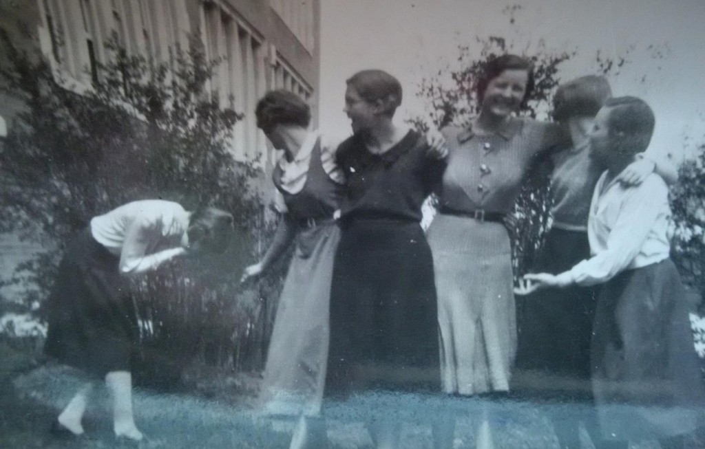 vintage photo of young women hugging and laughing