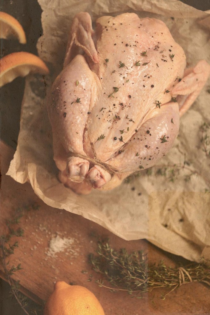 basted raw turkey with lemon and herbs