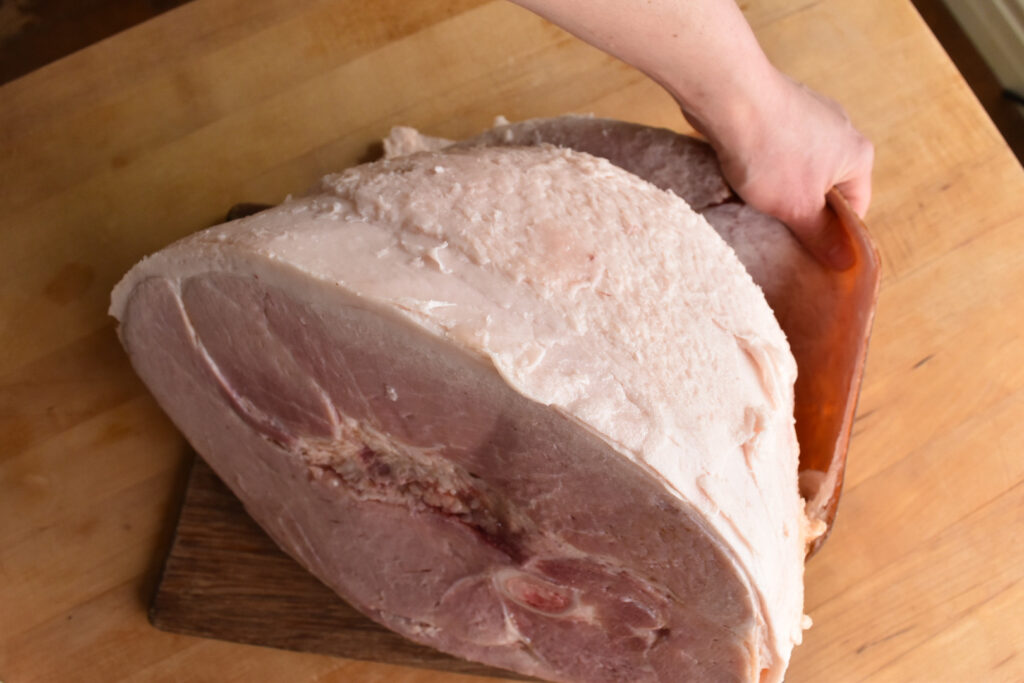 Removing the rind from a ham