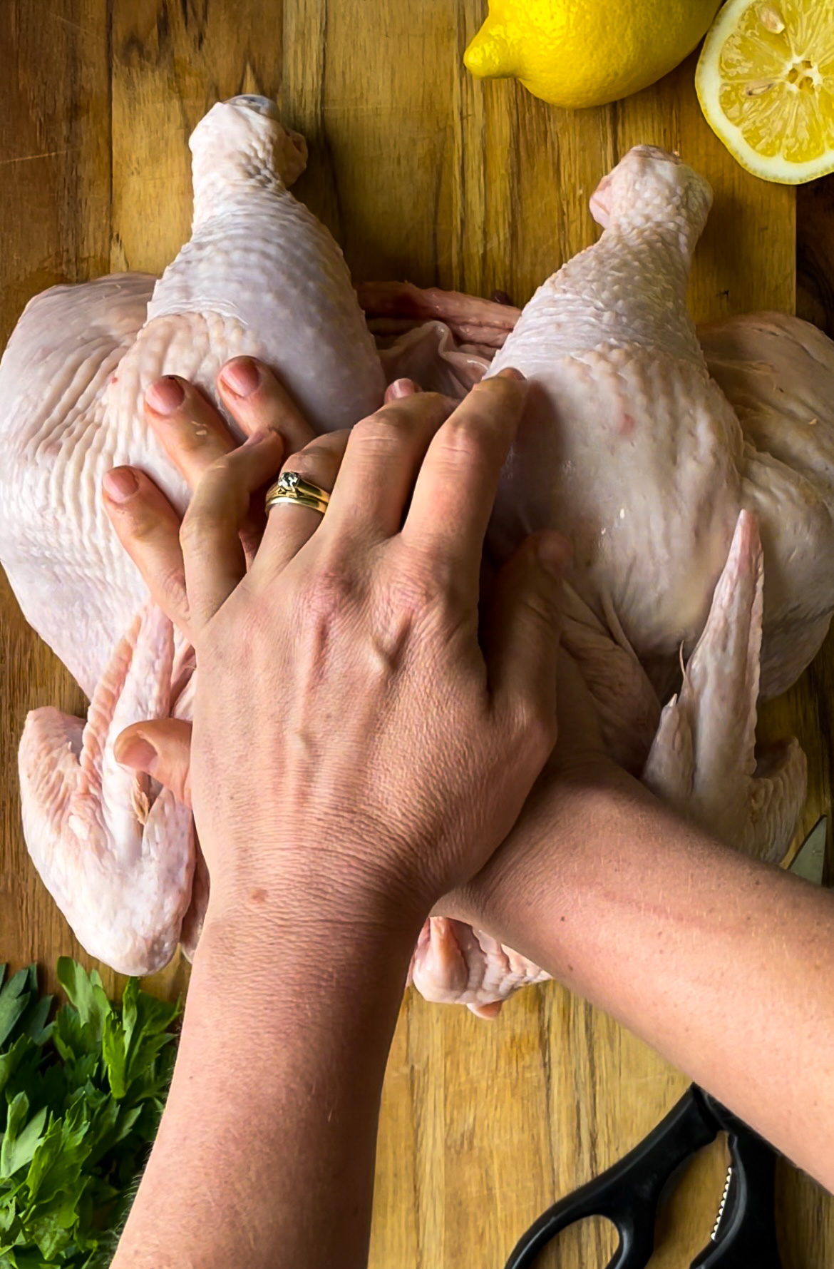 Press down to flatten a chicken