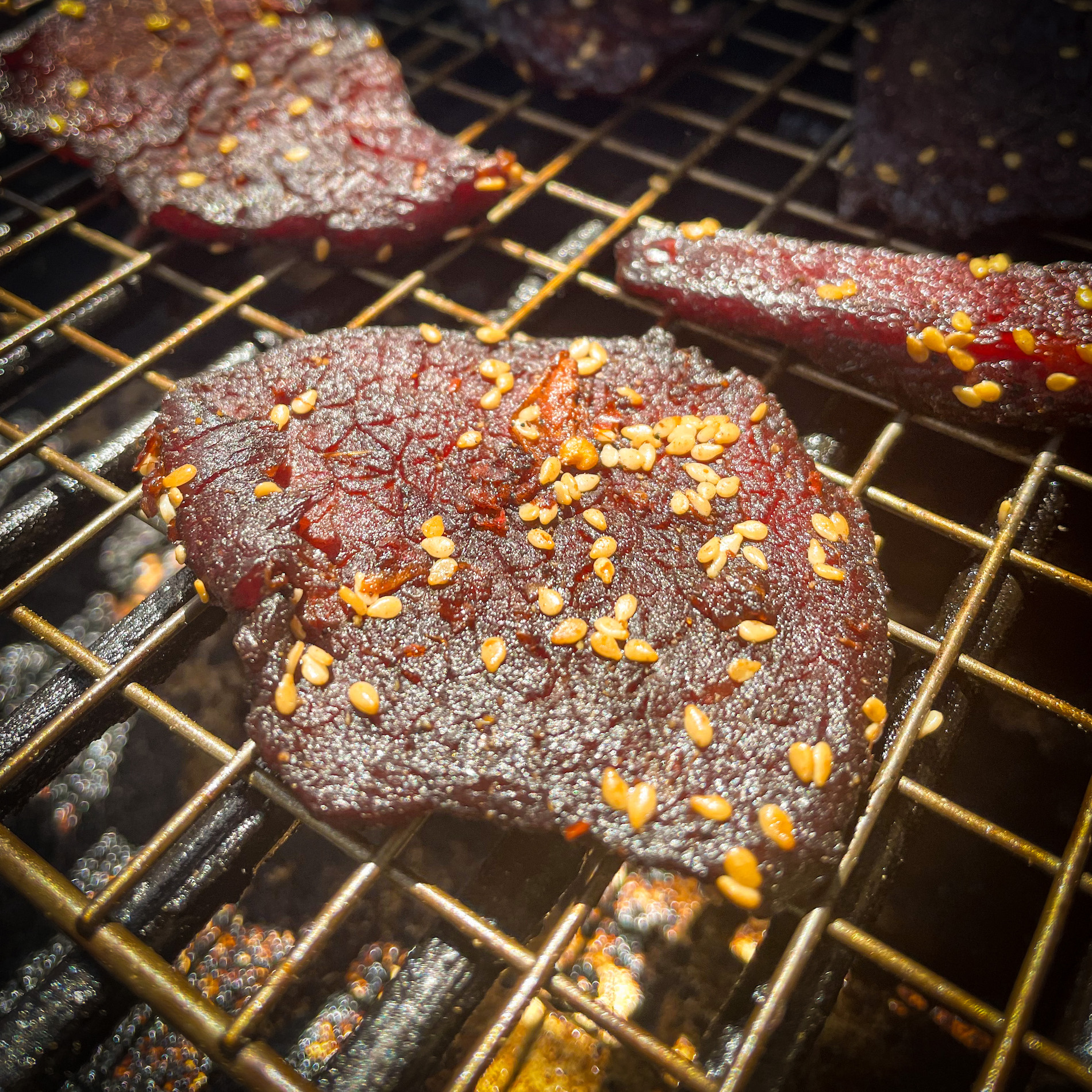 Beef jerky drying on the smoker
