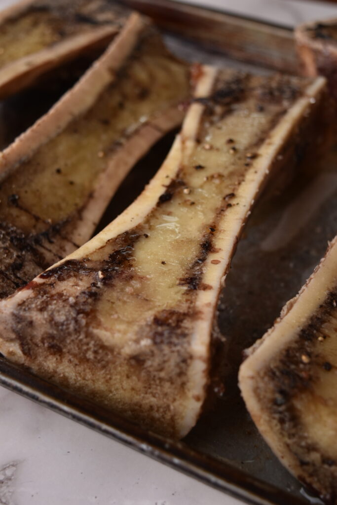 Canoe cut marrow bone being roasted
