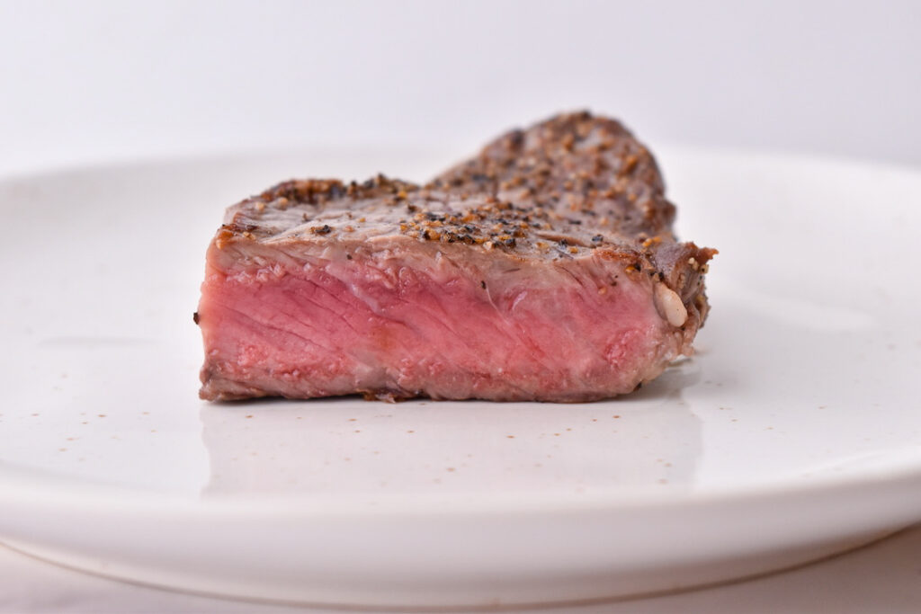 Steak Doneness Levels: Medium-rare steak pictured at the perfect temperature doneness