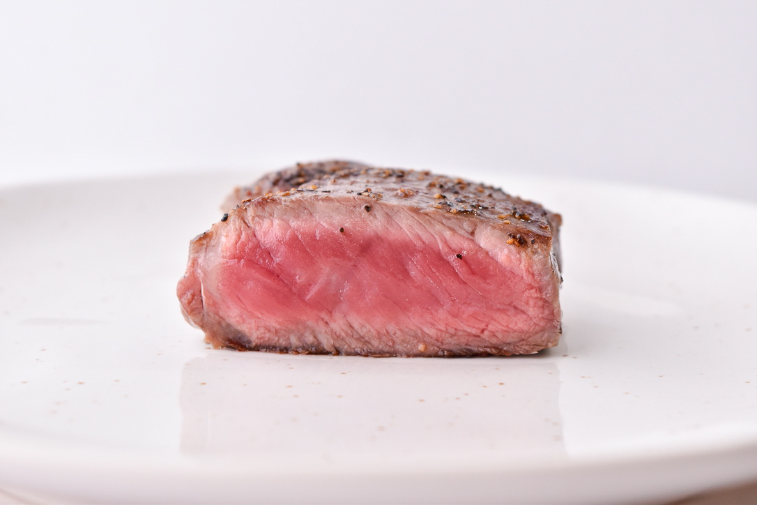 Steak Doneness Levels: Rare steak pictured at the perfect temperature doneness