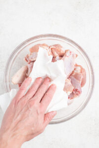 Pat the chicken wings dry